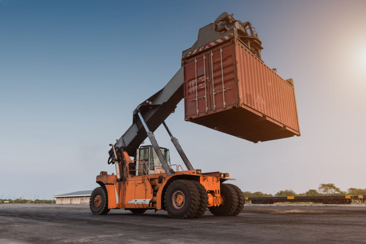 Cargo Forklift handling container box loading import or export industrial to docks with freight truck